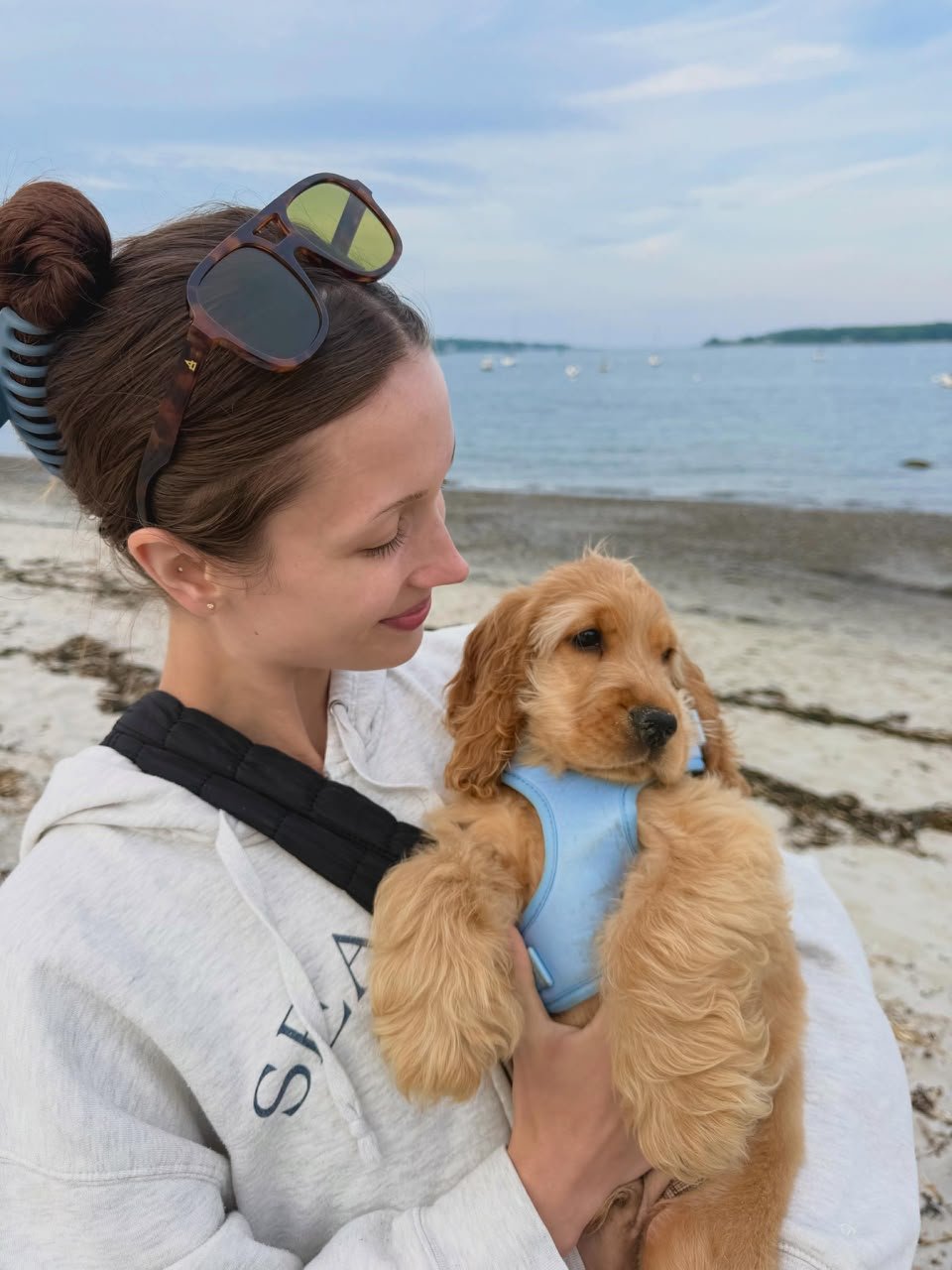 James and Priya Anand with their Cocker Spaniel puppy Maple in Charlotte, North Carolina